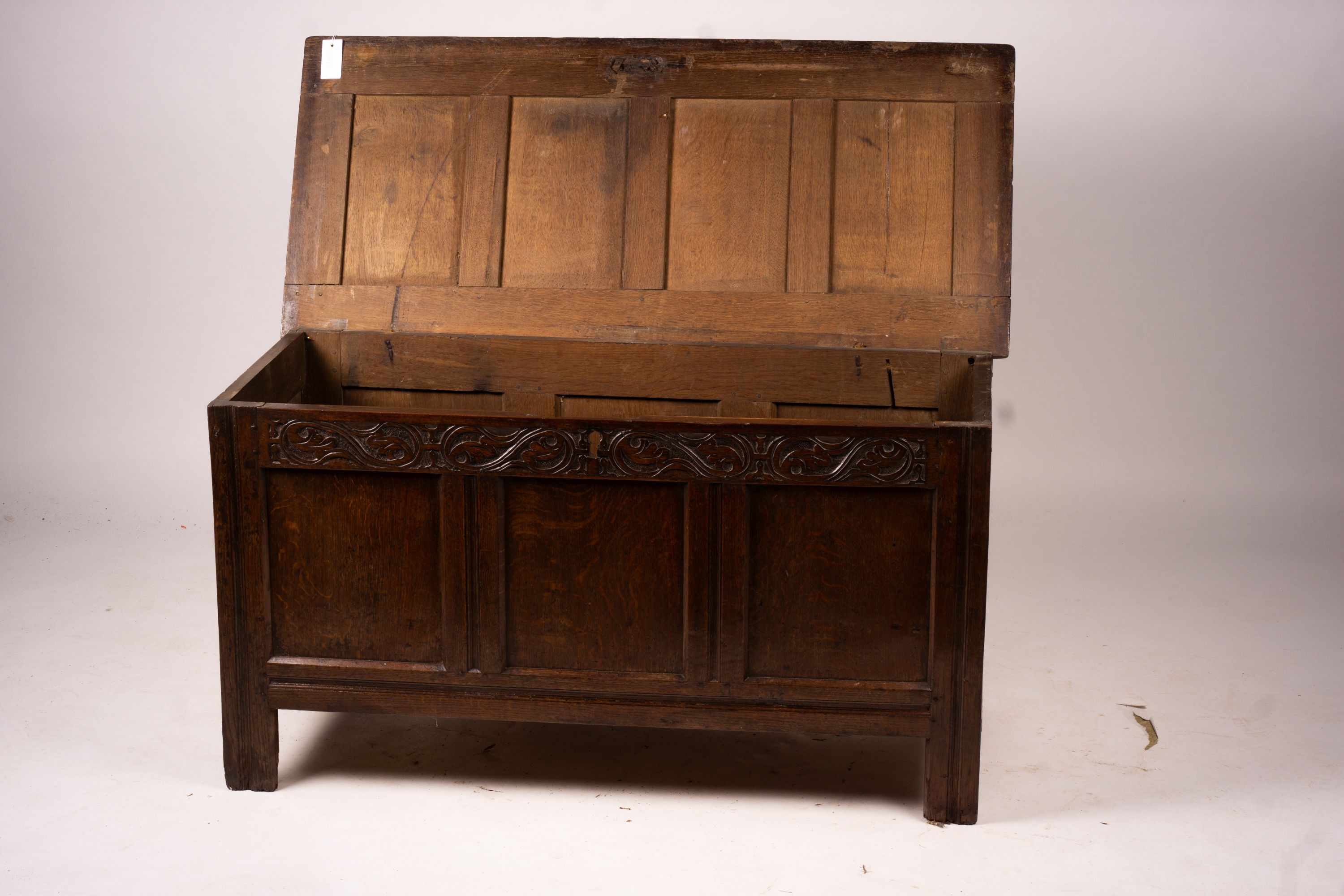 A 17th century panelled oak coffer, W.122cm D.55cm H.65cm